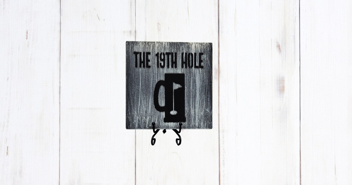 The 19th Hole sign on distressed gray pine