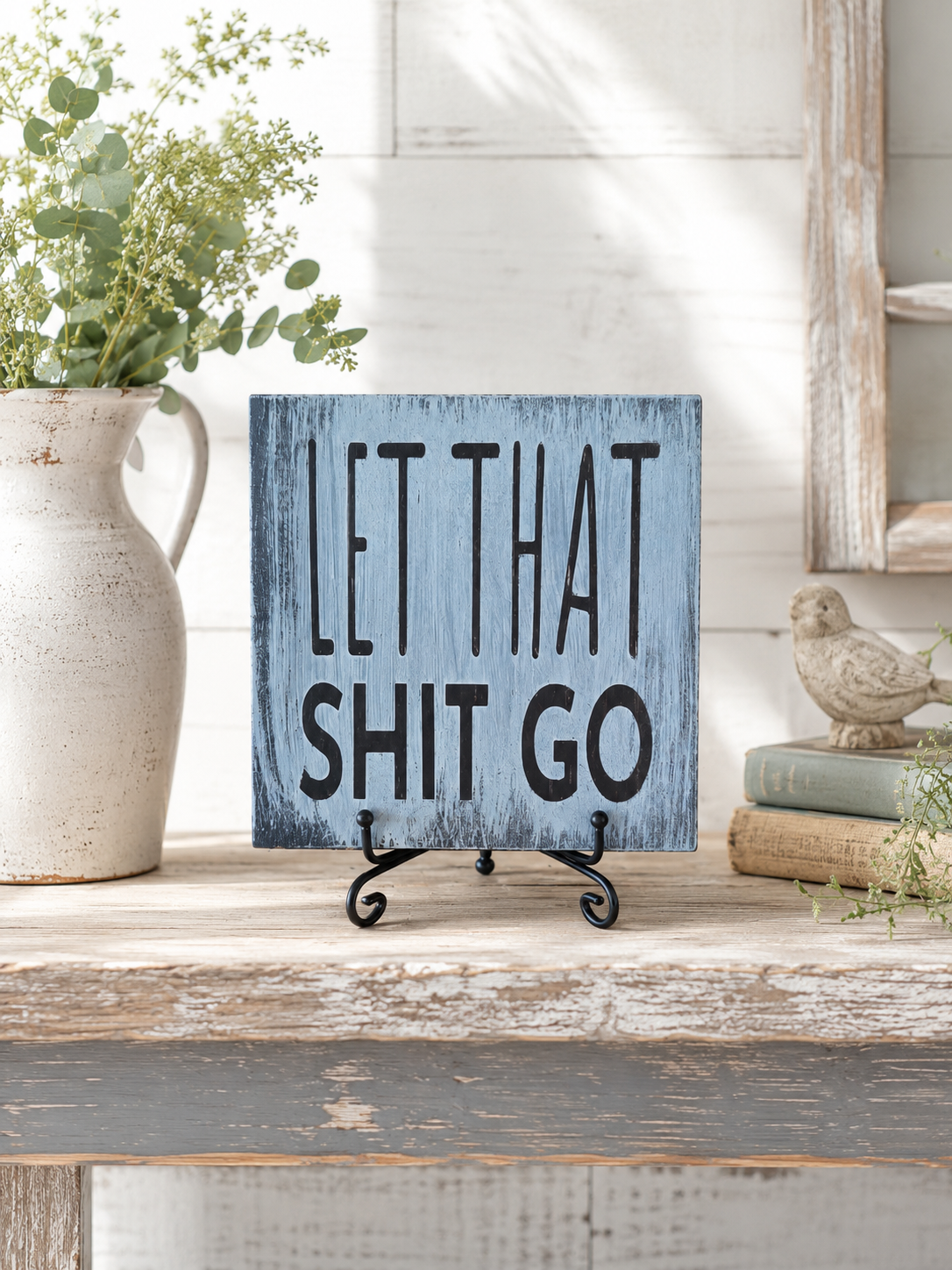 Let That Shit Go sign on distressed blue pine
