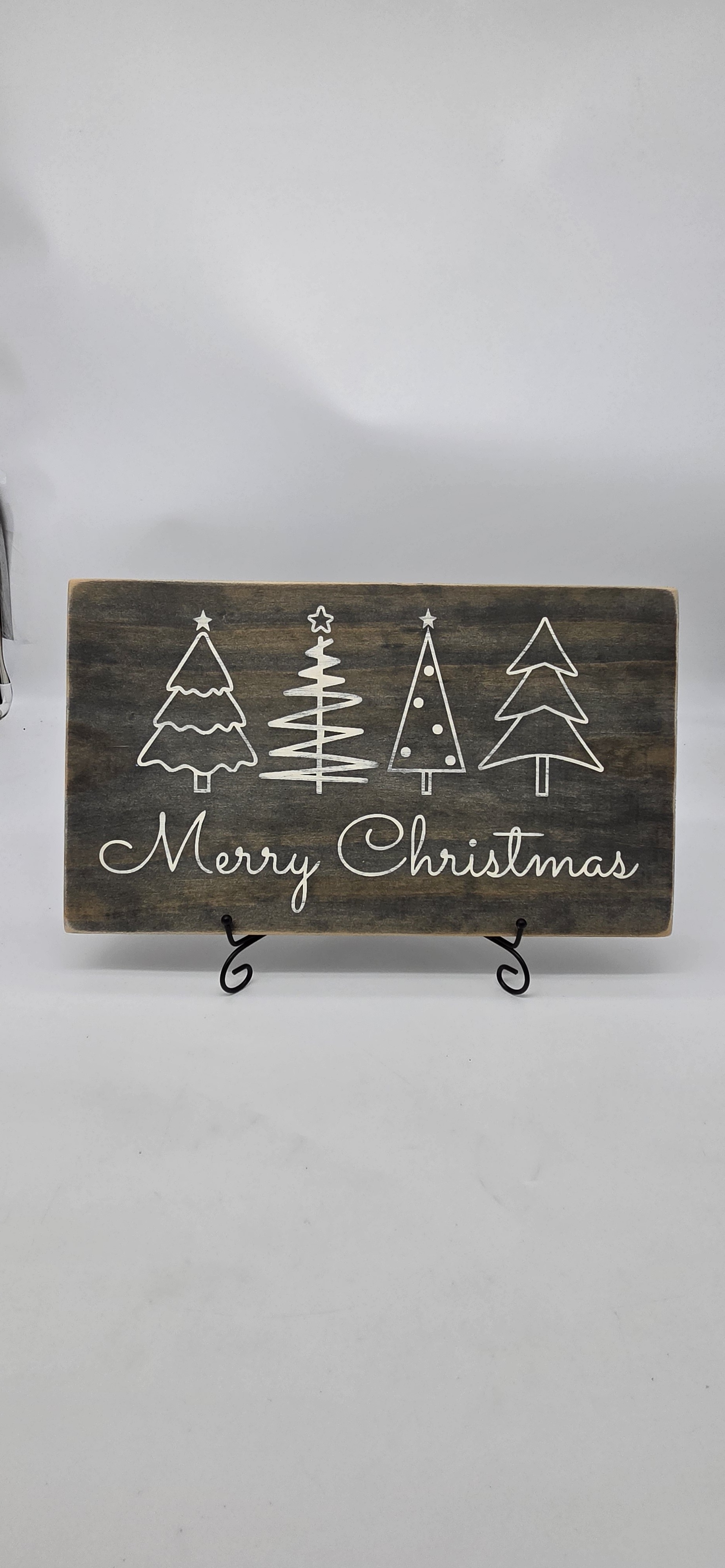 Merry Christmas four trees sign on dark stained pine