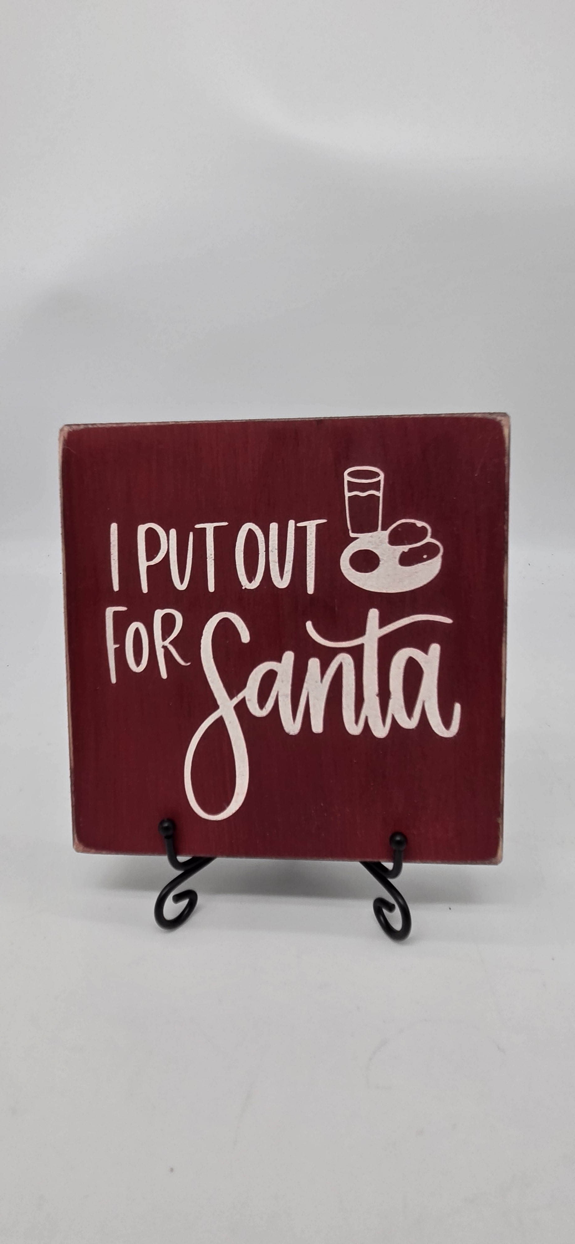 I Put Out for Santa sign on red pine